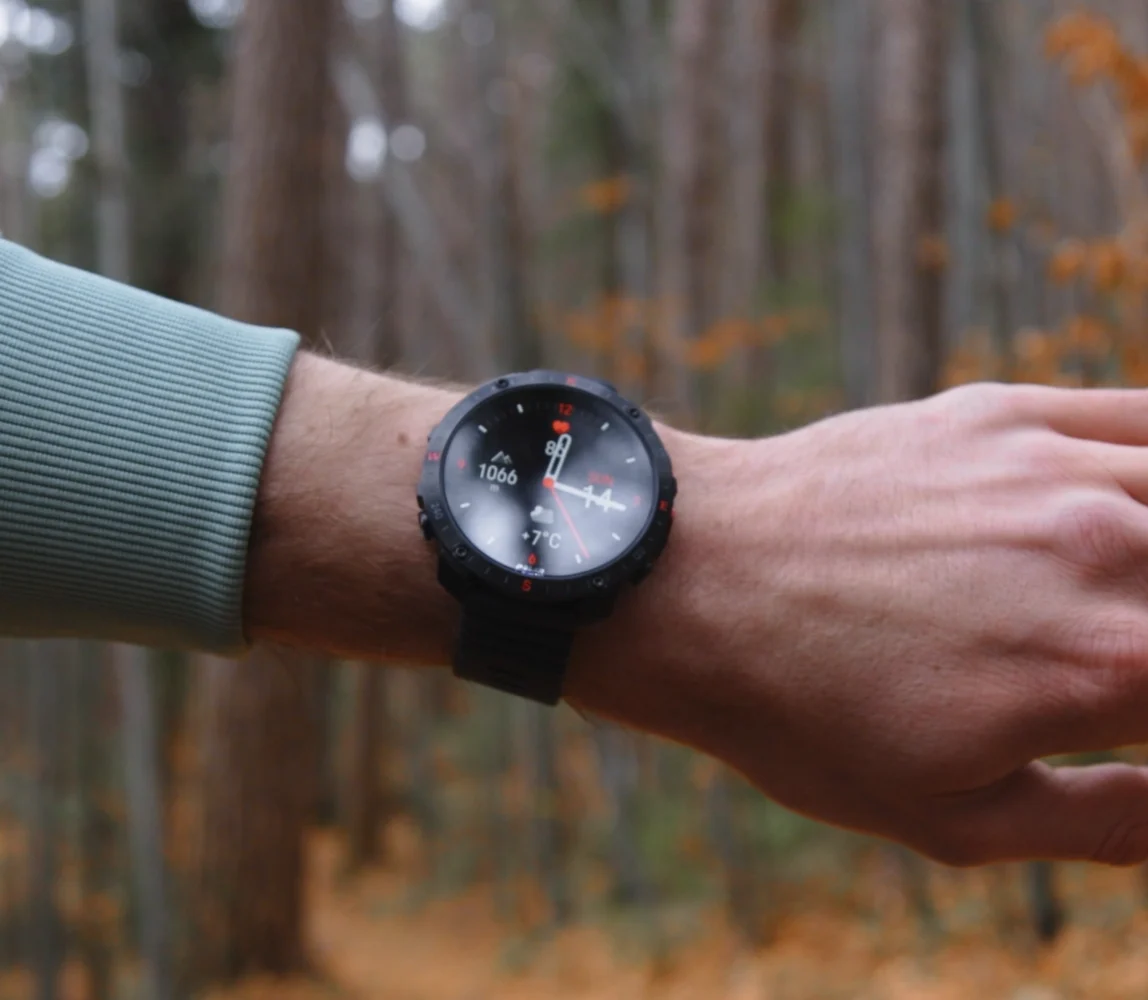 Polar Grit X2 Pro outdoor multisport watch on a runner’s wrist in woodland